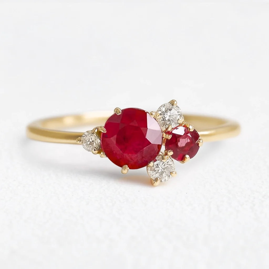 Rosalind’s Rose | Round Ruby Engagement Ring with Drifting Diamond Petal Halo