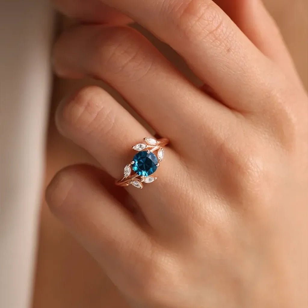 Eleonora’s Radiance | Round Blue Sapphire Vine Engagement Ring