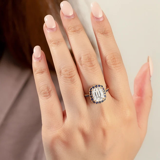 Aurora’s Luminary | 2CT Emerald Cut Diamond Sapphire Halo & Pavé Ring
