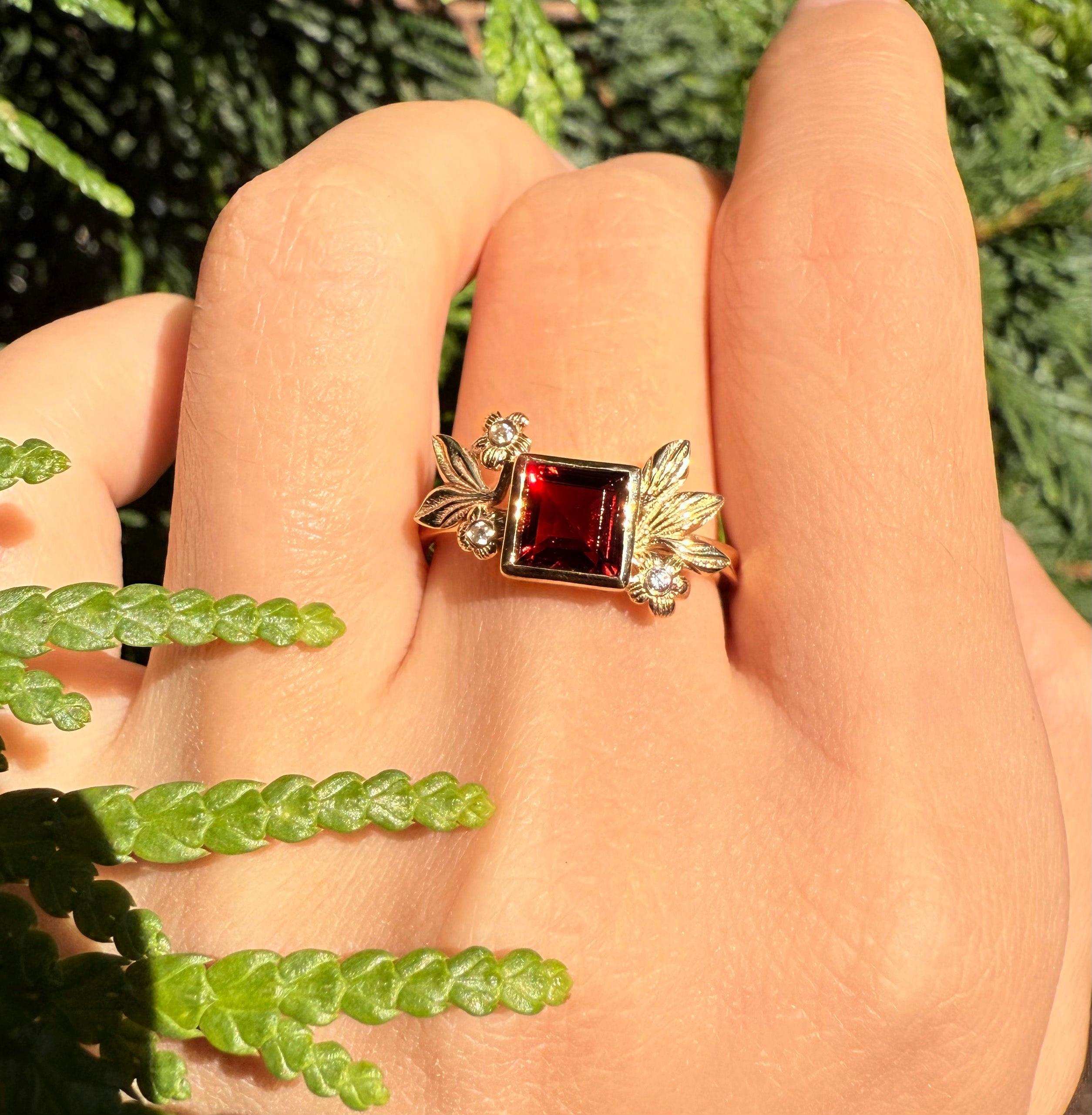 Juliet’s Crimson | Classic Princess Cut Red Ruby Leafy Halo Engagement Ring