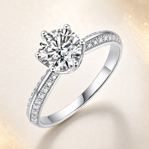 Sterling Silver Brilliant Cut Moissanite Solitaire Ring — front view on Luminous Pearl Gallery background