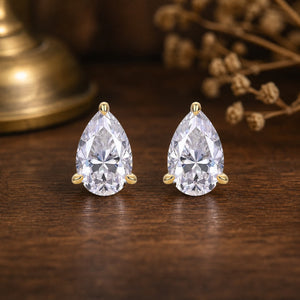 Pear-Shaped Inspiration Studs Earrings – front view on warm walnut background