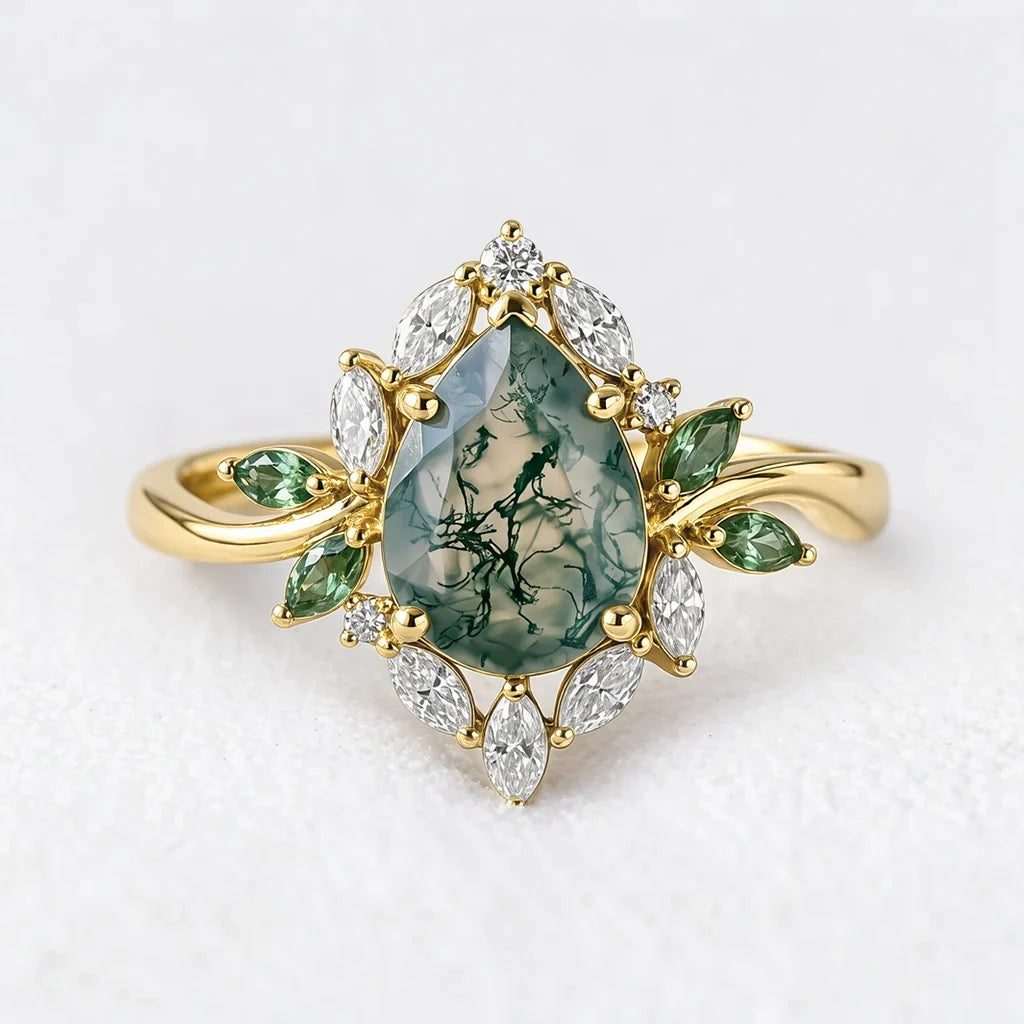 Daphne's Bloom pear moss agate and moissanite cluster engagement ring
