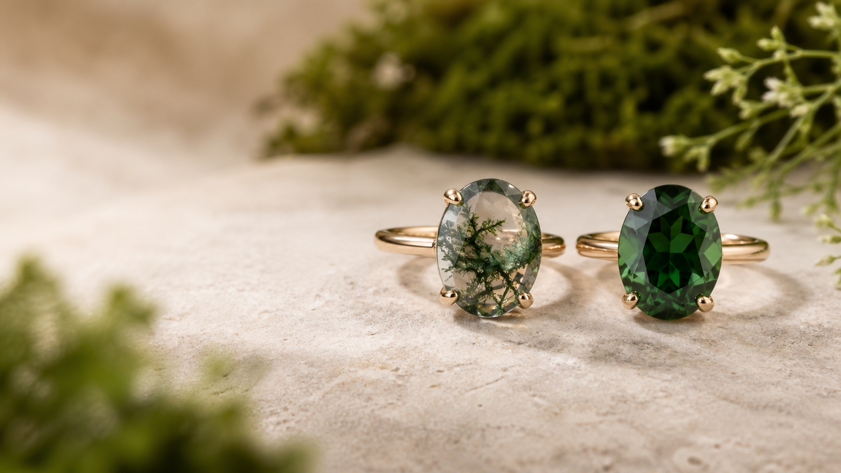 Moss agate and green sapphire engagement rings shown side by side in yellow gold