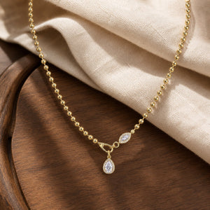 Golden Dainty Floral Station Necklace in Silver Moissanite on warm walnut
