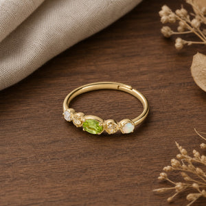 Adjustable Vintage Gold Peridot Stacking Ring on walnut tabletop