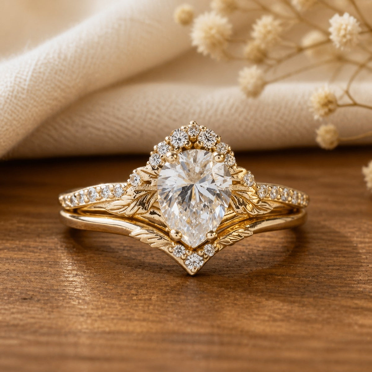 Victoria’s Griffin vintage moissanite halo and leaf bridal set on natural walnut tabletop