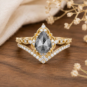 Charlotte's Grace 1.5ct Oval Salt and Pepper Moissanite Vintage Bridal Ring Set on warm walnut tabletop
