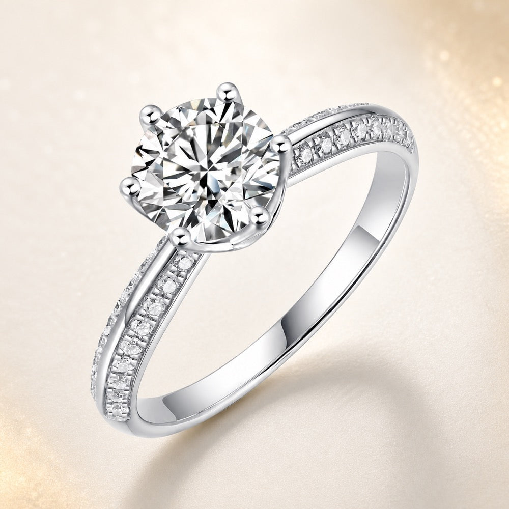 Sterling Silver Brilliant Cut Moissanite Solitaire Ring — front view on Luminous Pearl Gallery background