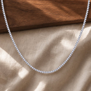 Silver moissanite dazzling snowflake pendant necklace on warm walnut