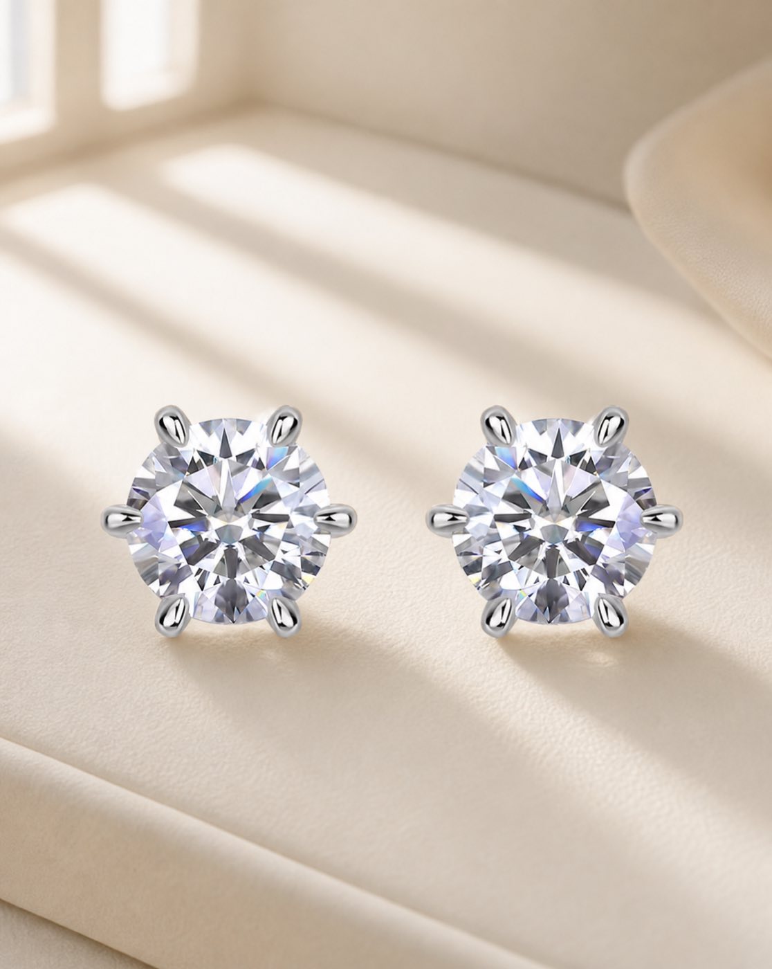 Round six claw sparkle silver moissanite stud earrings on warm walnut