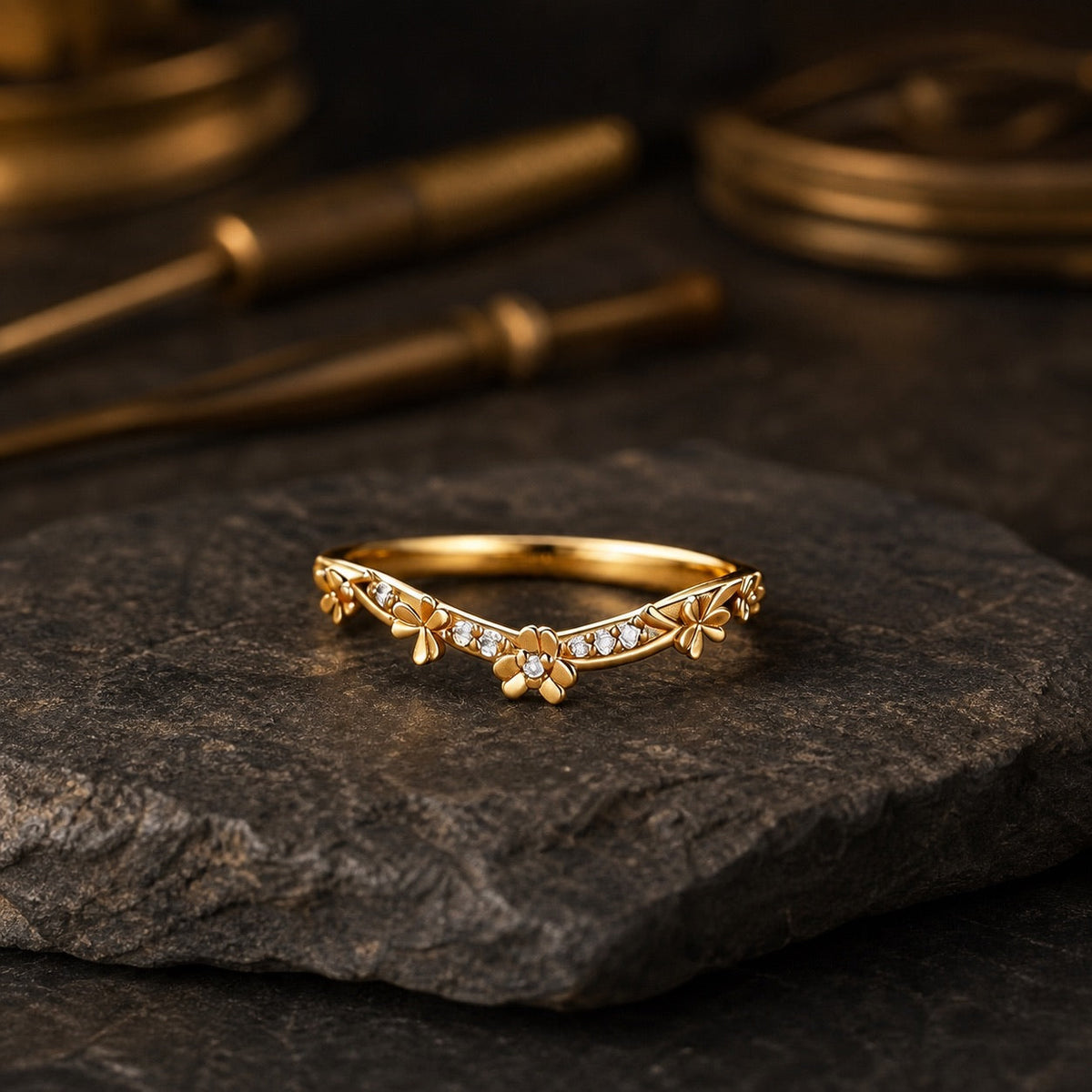 Leaf clover curved wedding band on warm charcoal limestone
