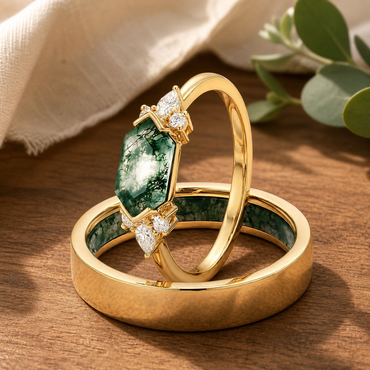 Alexandra's Veil hexagon moss agate couple ring duo in a natural wood jewelry scene