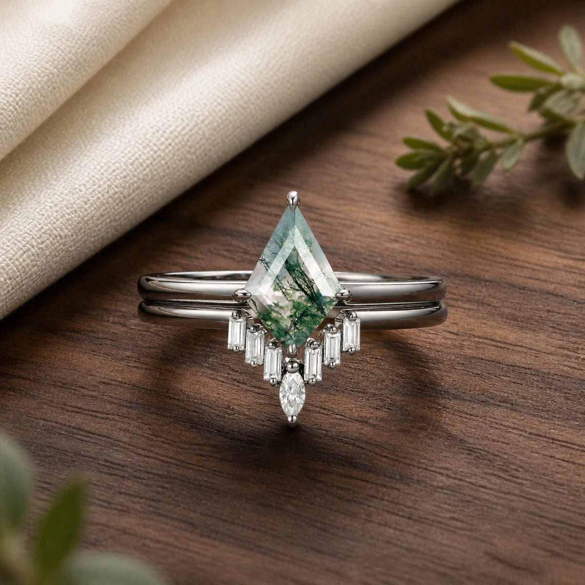 Black Gold Moss Agate Baguette Engagement Ring Set on natural walnut tabletop