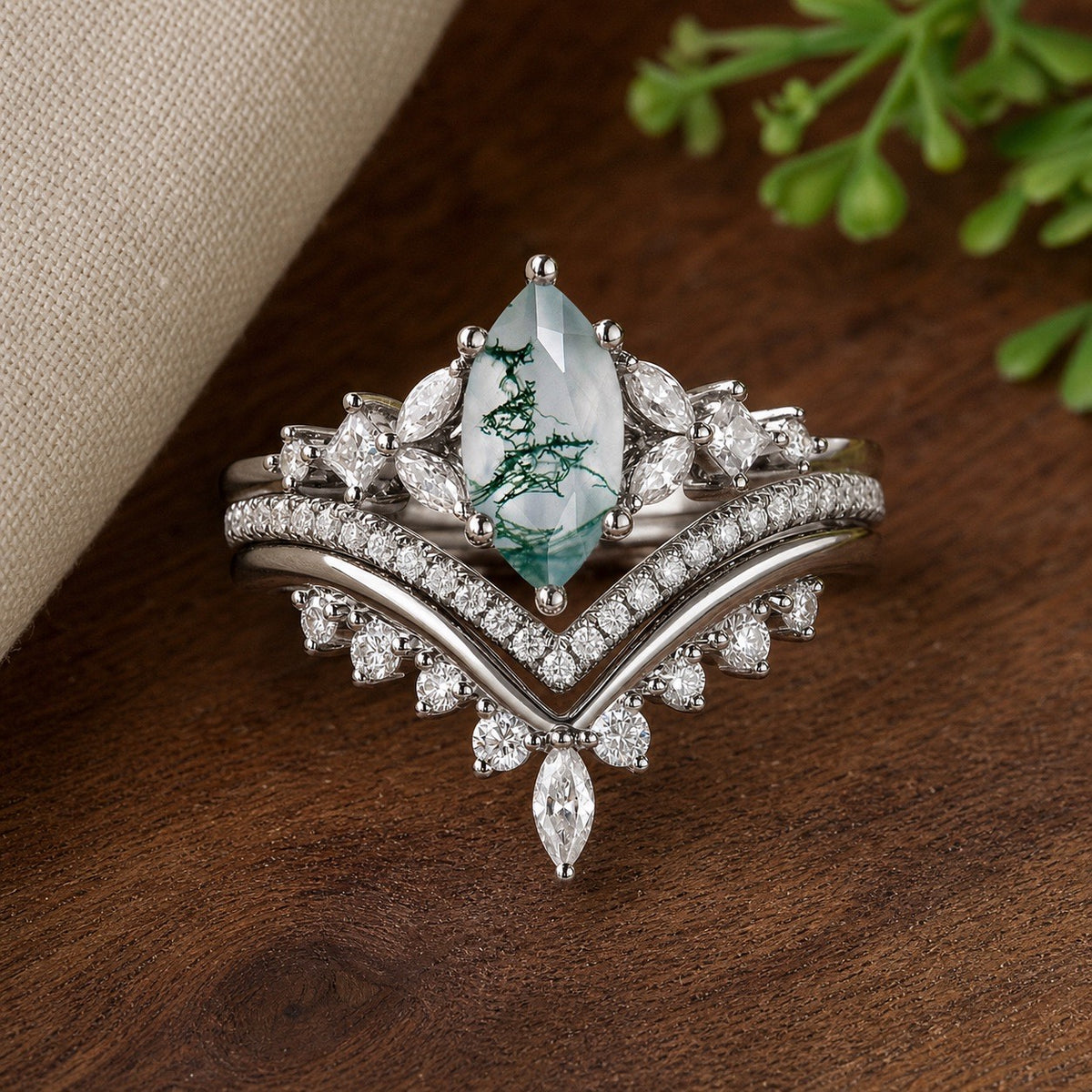 Black Gold Marquise Moss Agate Engagement Ring Set on natural walnut tabletop