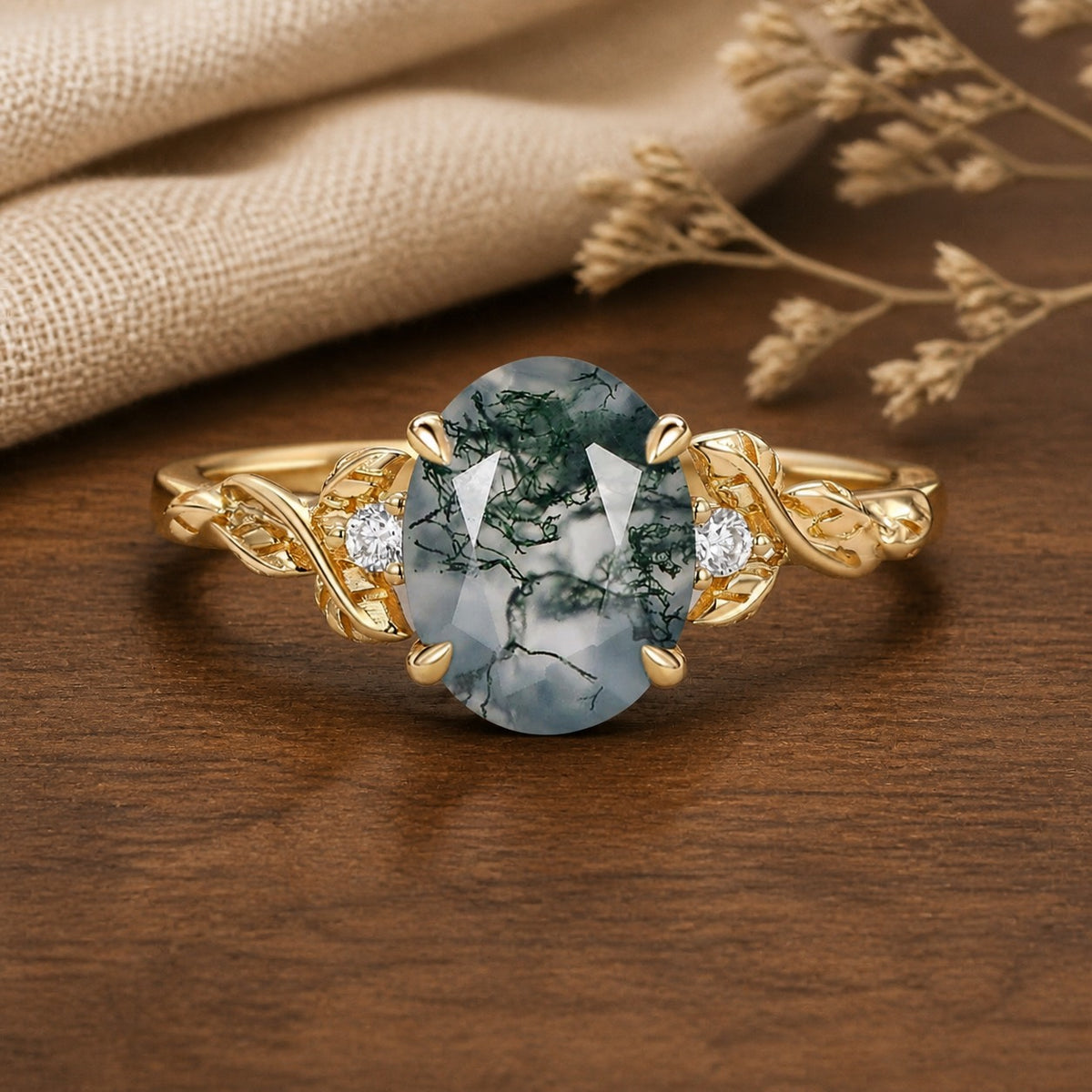 Clover Oval Cut Moss Agate Leafy Wedding Engagement Ring on walnut tabletop