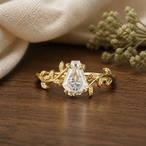 Coffin Shaped Moissanite Cluster Leaf Branch Engagement Ring on walnut tabletop
