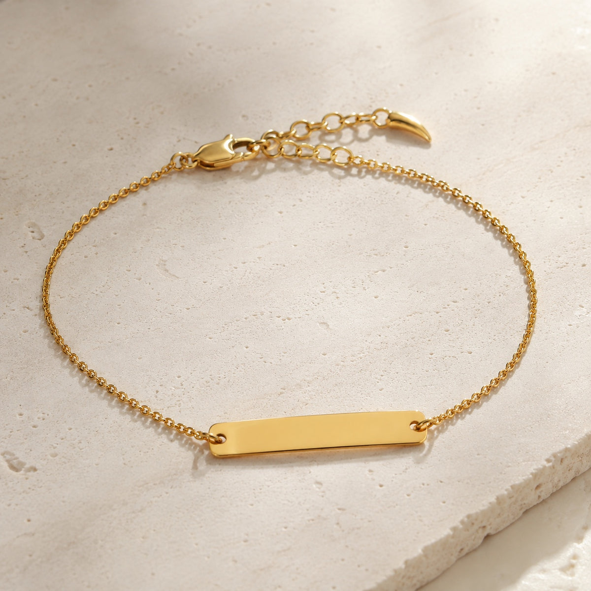 Gold vermeil engravable bar chain bracelet on pale stone