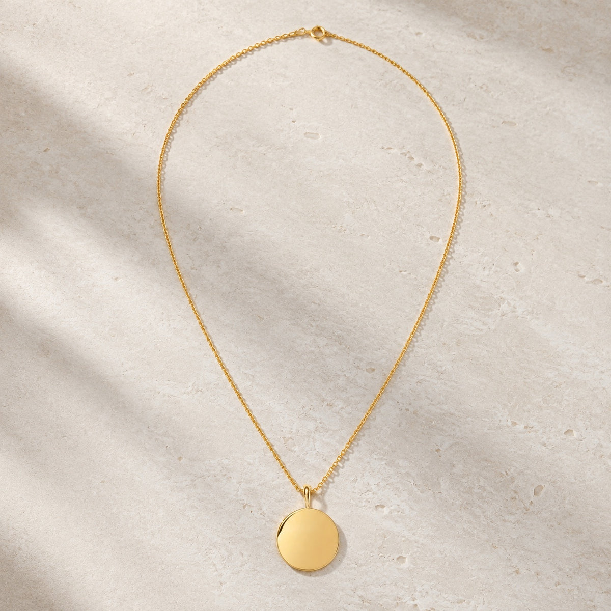 Gold vermeil round engravable pendant necklace on pale stone